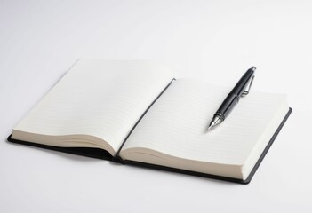 a notebook with a pen on top of it