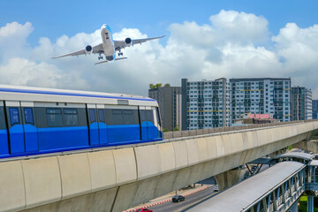 View railway track suburban subway electric train rushing departure station. Passenger plane flying...