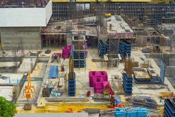 Construction of the first floor, cement foundation, supports of the future skyscraper, installation...