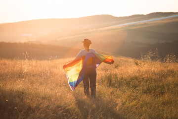 Young woman with LGBT flag.