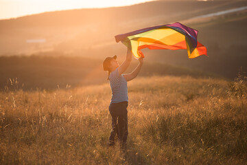 Young woman with LGBT flag.