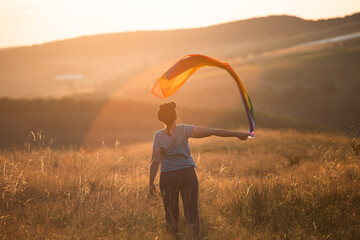 Young woman with LGBT flag.