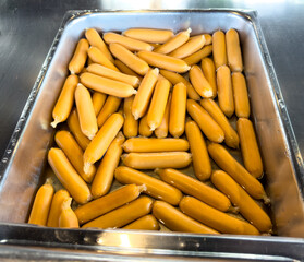 sausage in a metal dish in the dining room