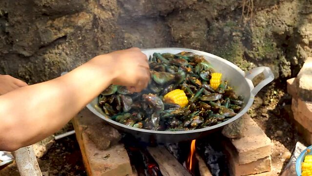 close up video, cooking green mussels. Perna viridis