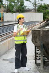 Portrait Hispanic Latin engineer worker woman working with cement precast and concrete mix at...