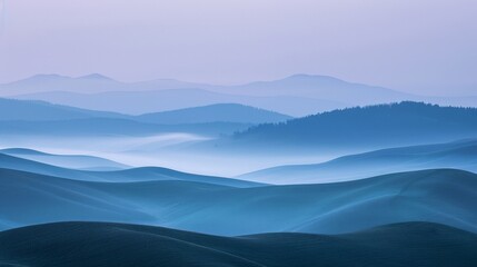 Serene mountain landscape with rolling hills and fog