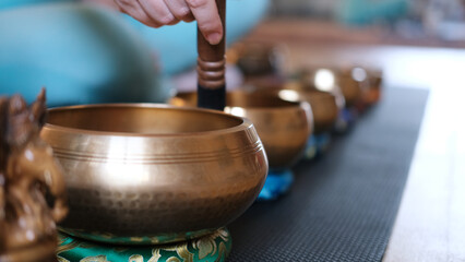 an accessory for mindfulness or meditation. Yoga, Tibetan musical bowls and on the floor, with...