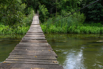 Fototapeta premium Suspension bridge, walkway to the adventurous, cross to the other side