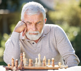 Senior man, chess and alone with thinking for strategy, outdoor for mental solution to challenge....