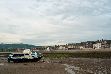 Fototapeta premium Boats moored in the harbour at Rhos-on-Sea at low tide.