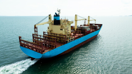 container ship sailing in sea, shipping business and industry service of cargo logistic import and export international freight transportation by container ship in open sea, aerial view