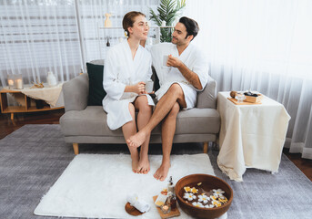 Beauty or body treatment spa salon vacation lifestyle concept with couple wearing bathrobe relaxing...