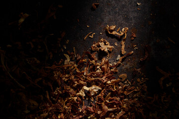 Dried cutted tobacco leaves. Textured abstract background.