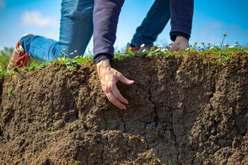 Helping hand idea concept. A man stretches out his hand to help in the pit or under the ground....