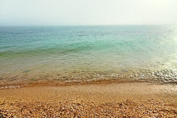 The Sea of Azov in the morning, at sunrise, the horizon in a haze
