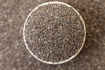 Chia seeds in bowl. Top view