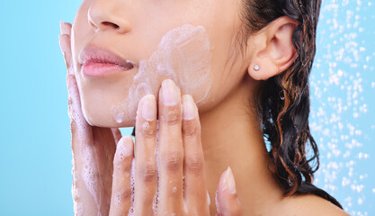 Hands, facial skincare and shower in studio with foam, cleaning and hygiene for wellness by blue...