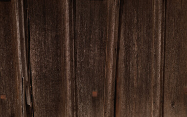 Texture of old weathered unpainted wooden fence