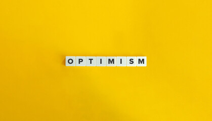 Optimism Word. Concept of Maintaining a Positive Outlook and Hopefulness about the Future. Block Letter Tiles on Flat Background. Minimalist Aesthetics.