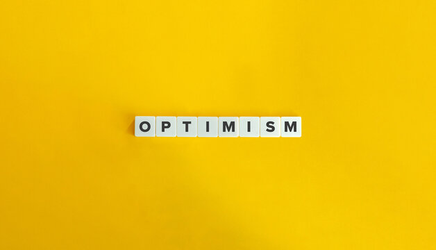 Optimism Word. Concept of Maintaining a Positive Outlook and Hopefulness about the Future. Block Letter Tiles on Flat Background. Minimalist Aesthetics.