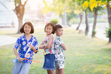 Children play in the summer sunny garden