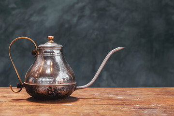 antique gooseneck kettle for brewing coffee or tea