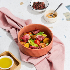 Delicious Roast Beef and Roasted Potato Salad with Fresh Lettuce and Cherry Tomatoes in a Rustic Bowl**