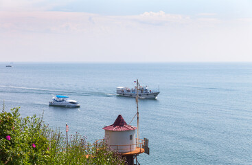 Baikal Lake in summer. Tourists travel by ship from the village of Listvyanka to Port Baikal....