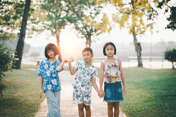 Children play in the summer sunny garden