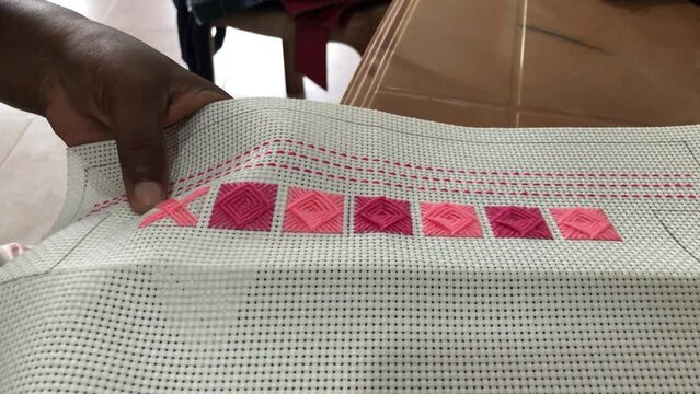 Cross stitch needle work on the aida fabric