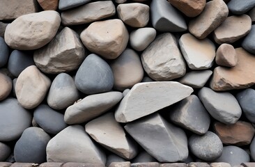 Collection of gray and tan stones arranged in a textured patternl