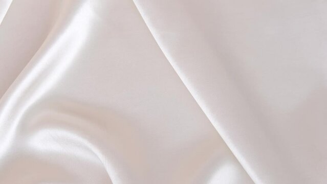 elegant delicate silk texture in white color with soft, slight movement of gentle folds, interior design concept, silk cloth background, copy space for designer, text mockup