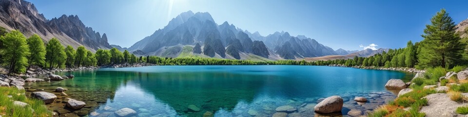 Tranquil lake reflects majestic mountains, creating a scenic wilderness destination. Beautiful photo of a mountain lake background for background.
