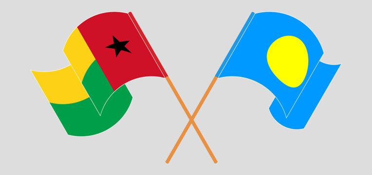 Crossed and waving flags of Guinea-Bissau and Palau