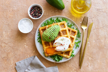 Belgian waffles with avocado and poached egg. Healthy eating. Vegetarian food. Breakfast.