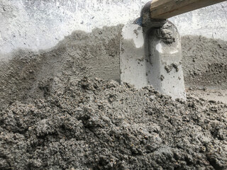 Construction concept, The mixing of stone, Cement, Sand together to make a strong concrete building