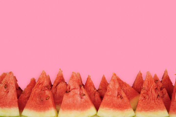 Summer fruit background concept, tasty juicy red watermelon cuts with pink copy space background