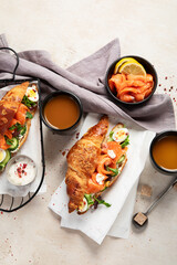 Freshly cooked homemade croissant sandwich with natural salmon fish.