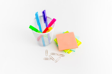 Office desk table with supplies, sticky notes and coloured pens. Top view with copy space. Flat lay. Time management. 