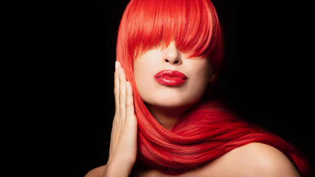 Sensual sexy beauty portrait of a red haired young woman with a healthy long hair