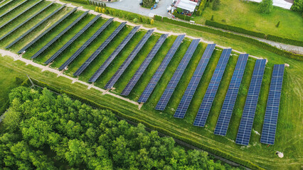 Drone view of solar farm at sunset Solar panels producing power