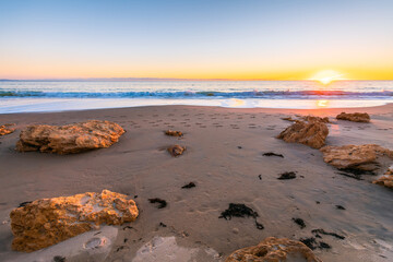 Maslin Beach with rocks at sunset, Fleurieu Peninsula, South Australia