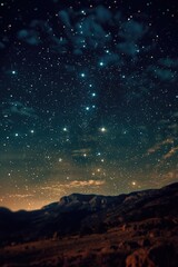 Fototapeta premium A picturesque night sky filled with stars above a majestic mountain. Ideal for nature and landscape backgrounds