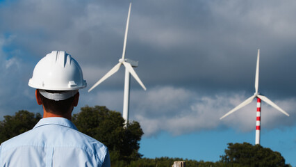 Engineer Taking A Look At The Wind Turbines 