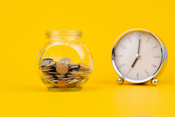 Saving coins in a glass jar, accumulating balance, creating financial discipline. income from work Mutual funds and investing in cash flow
