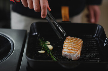 Chef cooks pork steak. Recipe book, cooking, restaurant business