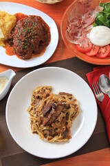 Grilled Foie gras steak with with Fettuccine pasta on restaurant table