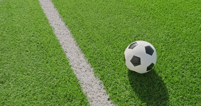 Soccer field impressions  - A soccer ball on a soccer field - Tilt-down shot