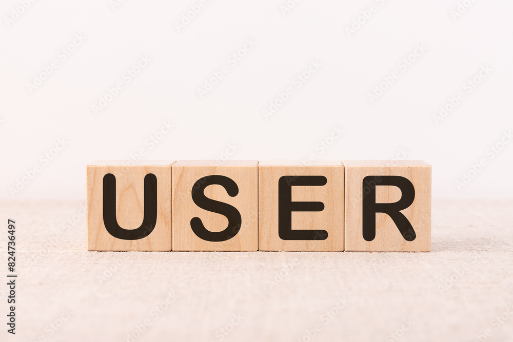 Fototapete user word made with building blocks on a light background