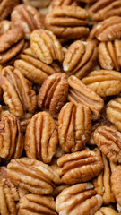 Heap of pecan nuts close up. Healthy food concept